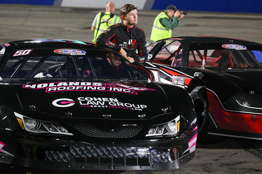 close up shot of Jett Noland number 50 standing next to his car after the Bill Rigley Memorial 128.